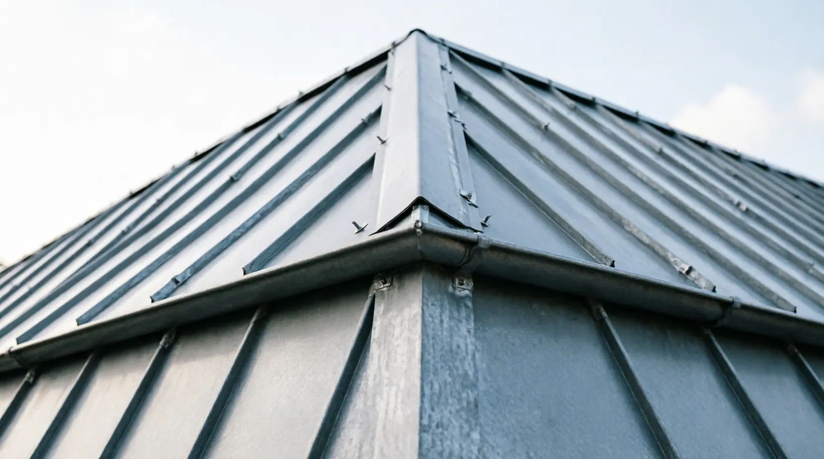 Zinc detailing at the junction with the existing roof.